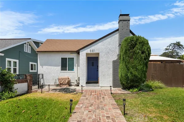 a house view with a garden space