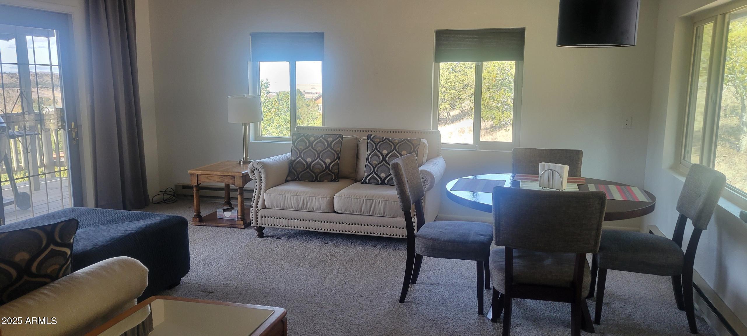 1285 Spruce Street Eagar, AZ 85925 - Photo 6 of 17 a living room with furniture and a window