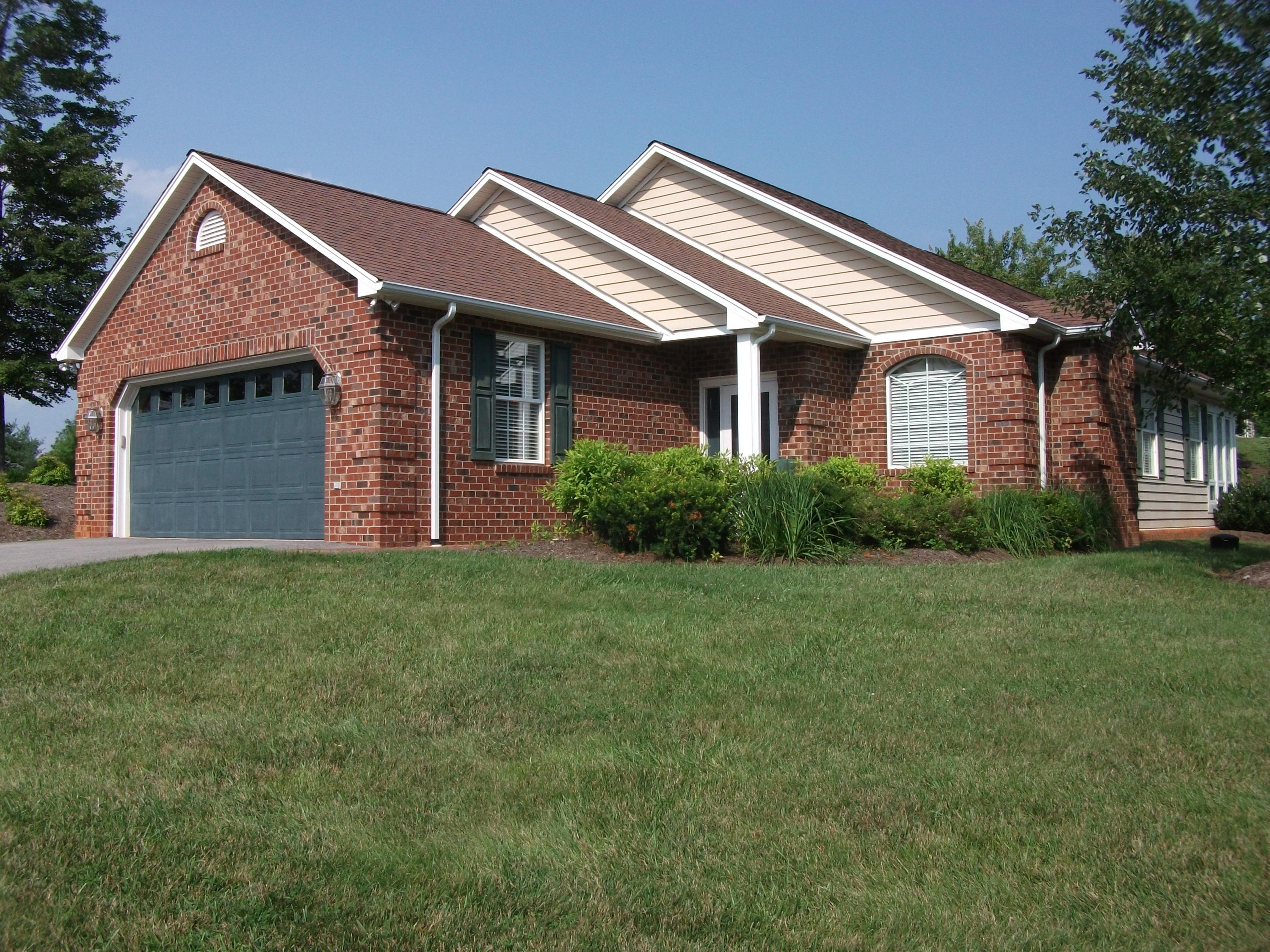 94 Stoney Mill Road Rocky Mount, VA 24151 - Photo 1 of 24 a front view of a house with a garden