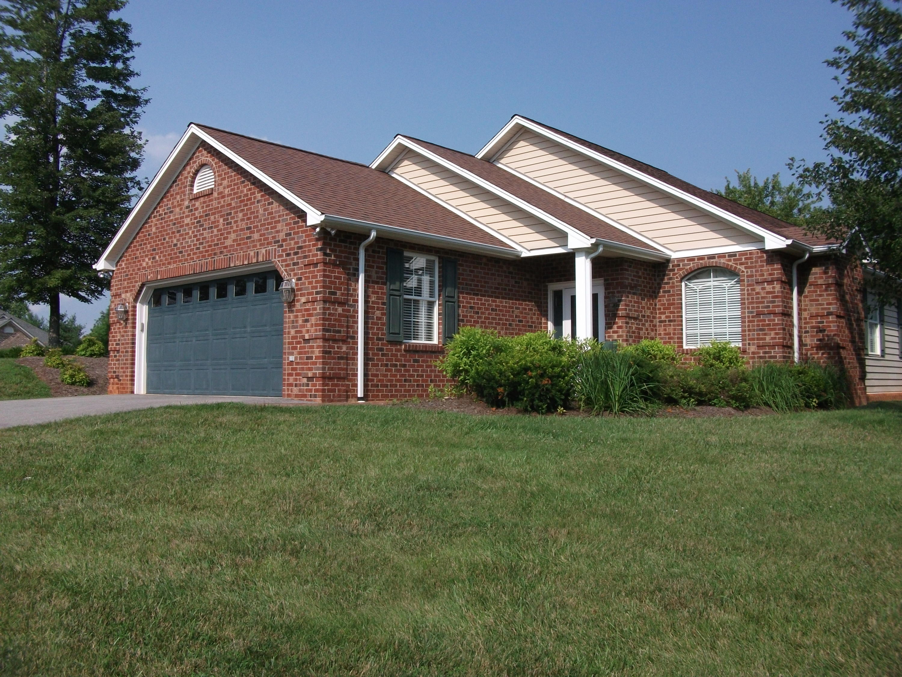 94 Stoney Mill Road Rocky Mount, VA 24151 - Photo 22 of 24 a front view of a house with a garden