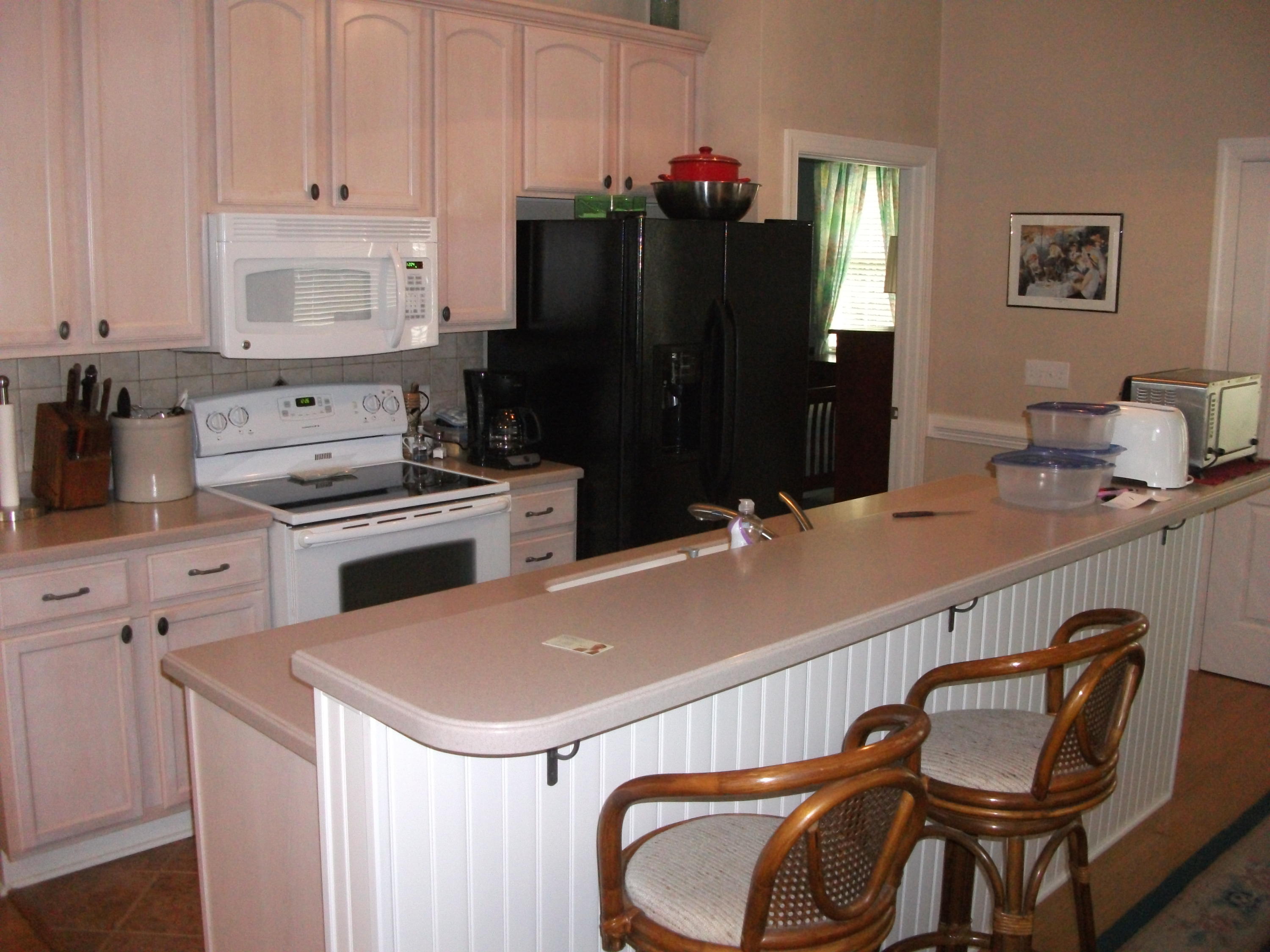 94 Stoney Mill Road Rocky Mount, VA 24151 - Photo 7 of 24 a kitchen with a refrigerator and a stove top oven