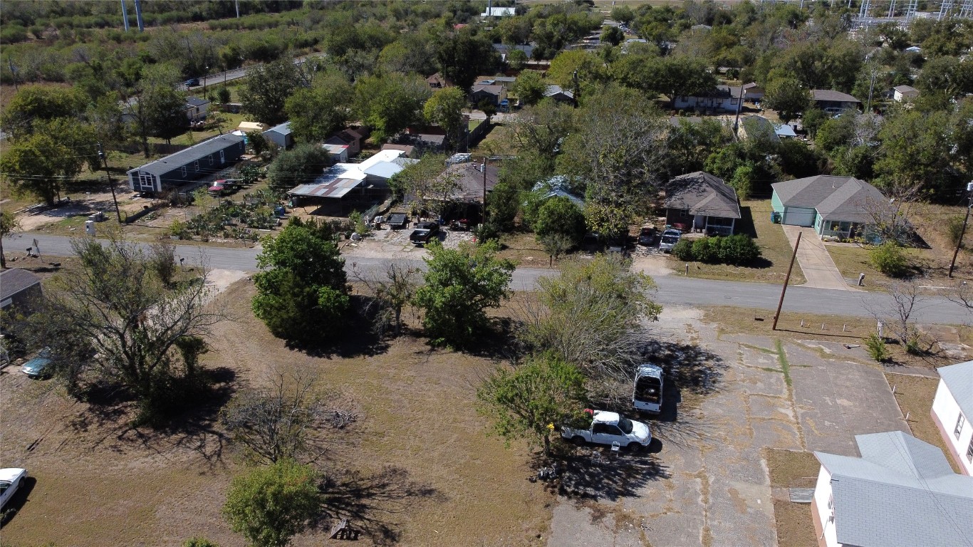 125 2nd Avenue Taylor, TX 76574 - Photo 2 of 9 an aerial view of a house with a yard and lake view