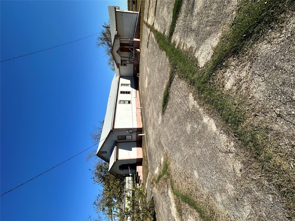 125 2nd Avenue Taylor, TX 76574 - Photo 3 of 9 a view of a house with wooden fence