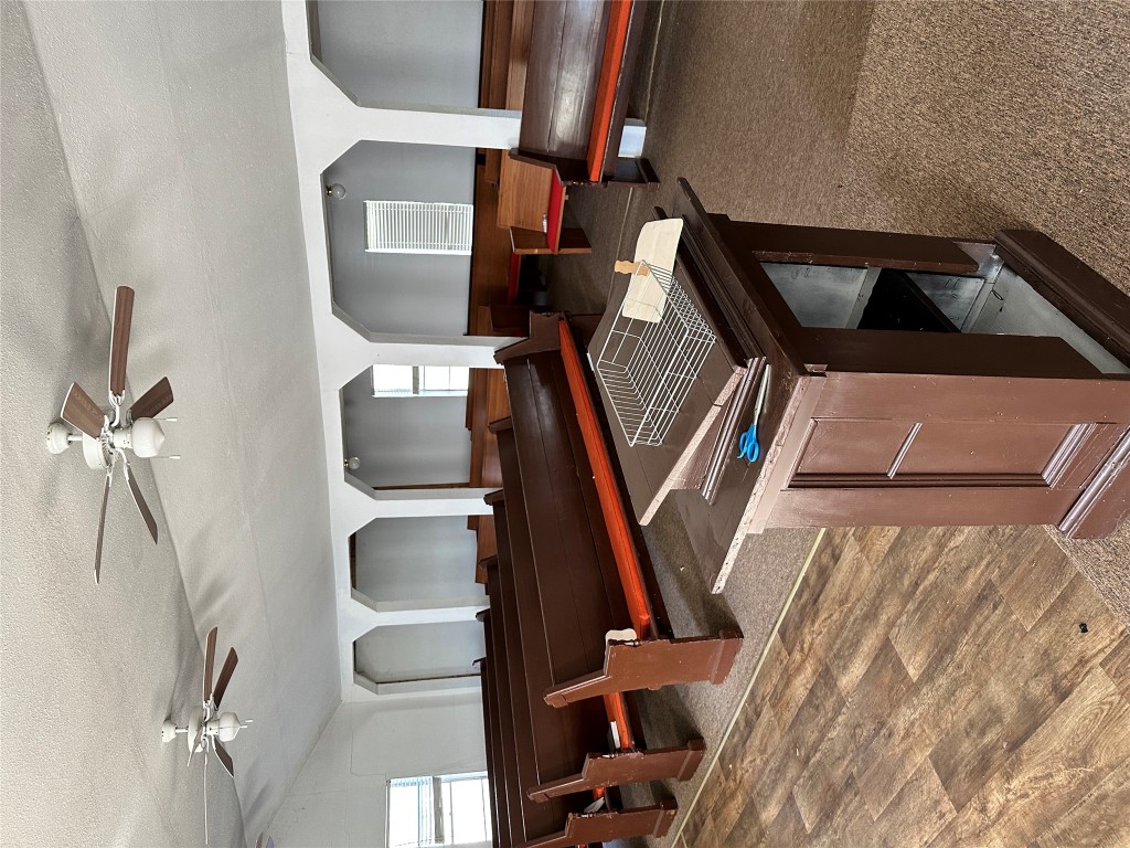 125 2nd Avenue Taylor, TX 76574 - Photo 4 of 9 a living room with a couch and a table