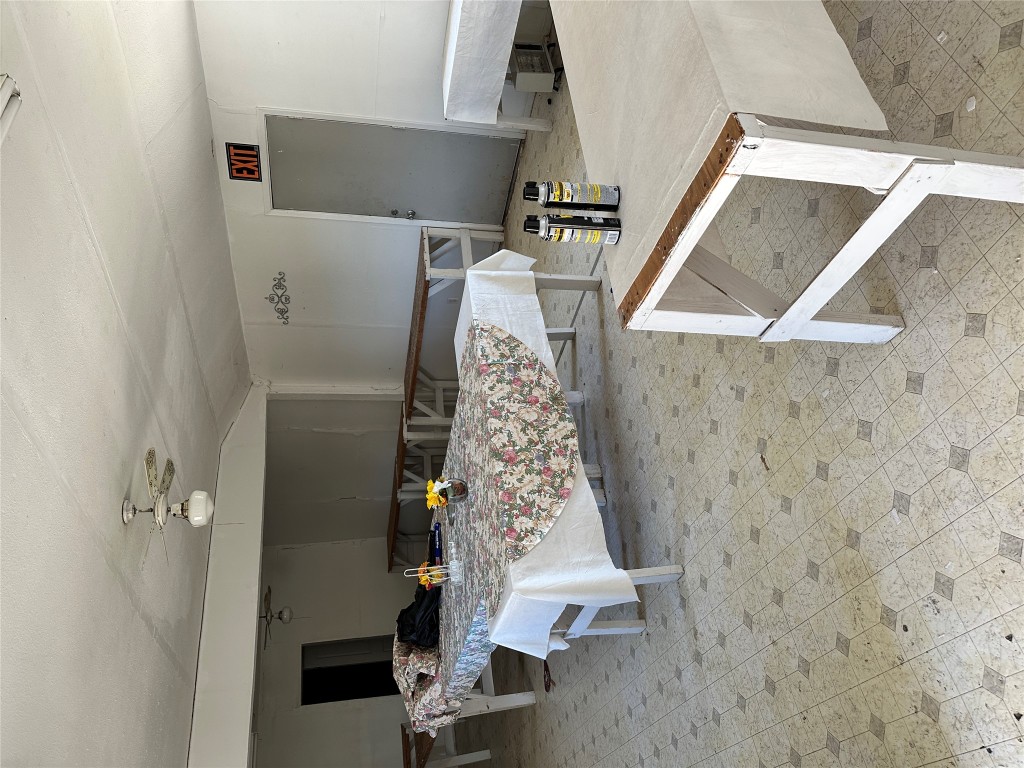 125 2nd Avenue Taylor, TX 76574 - Photo 6 of 9 a living room with furniture and a flat screen tv