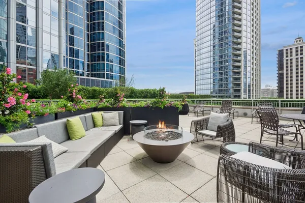 a view of a patio with couches and potted plants
