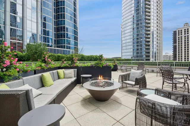 a view of a patio with couches and potted plants