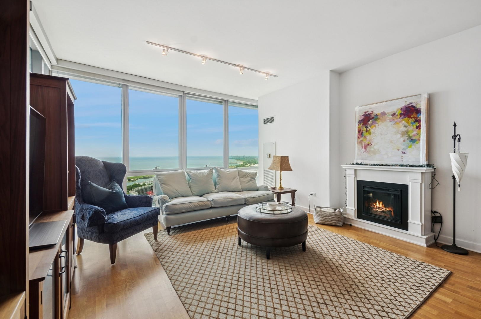 1201 South Prairie Avenue, Unit 4204 Chicago, IL 60605 - Photo 2 of 19 a living room with furniture and a fireplace