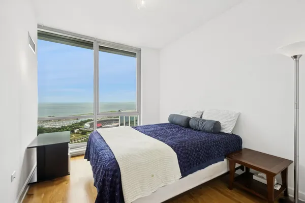 a bedroom with a bed and window