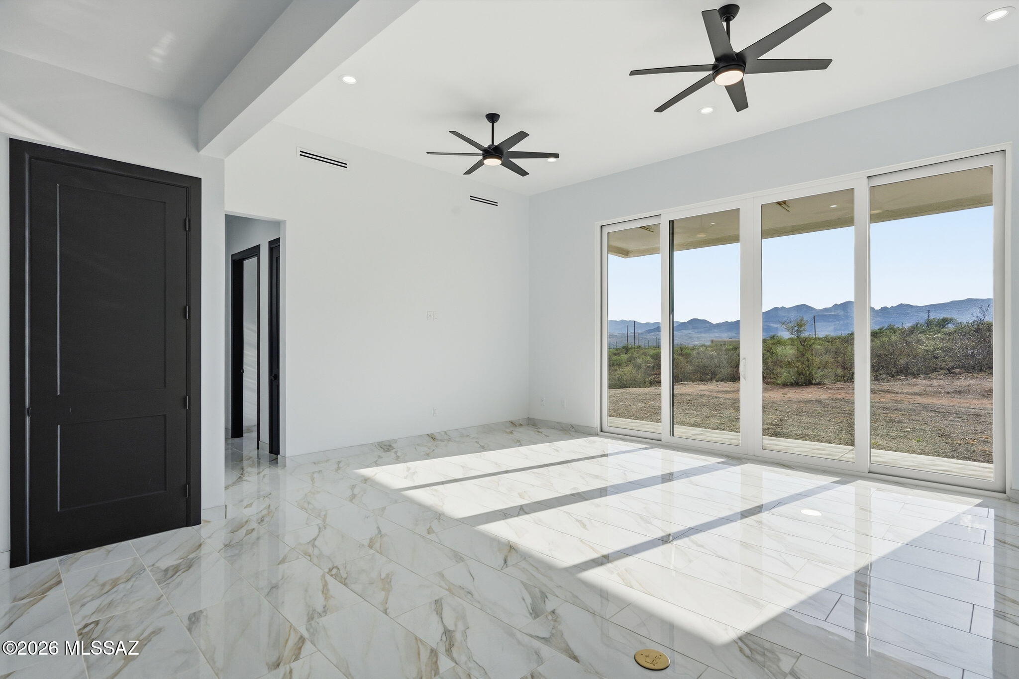 1786 Peralta Court Rio Rico, AZ 85648 - Photo 18 of 50 a bedroom with a bed and a large window
