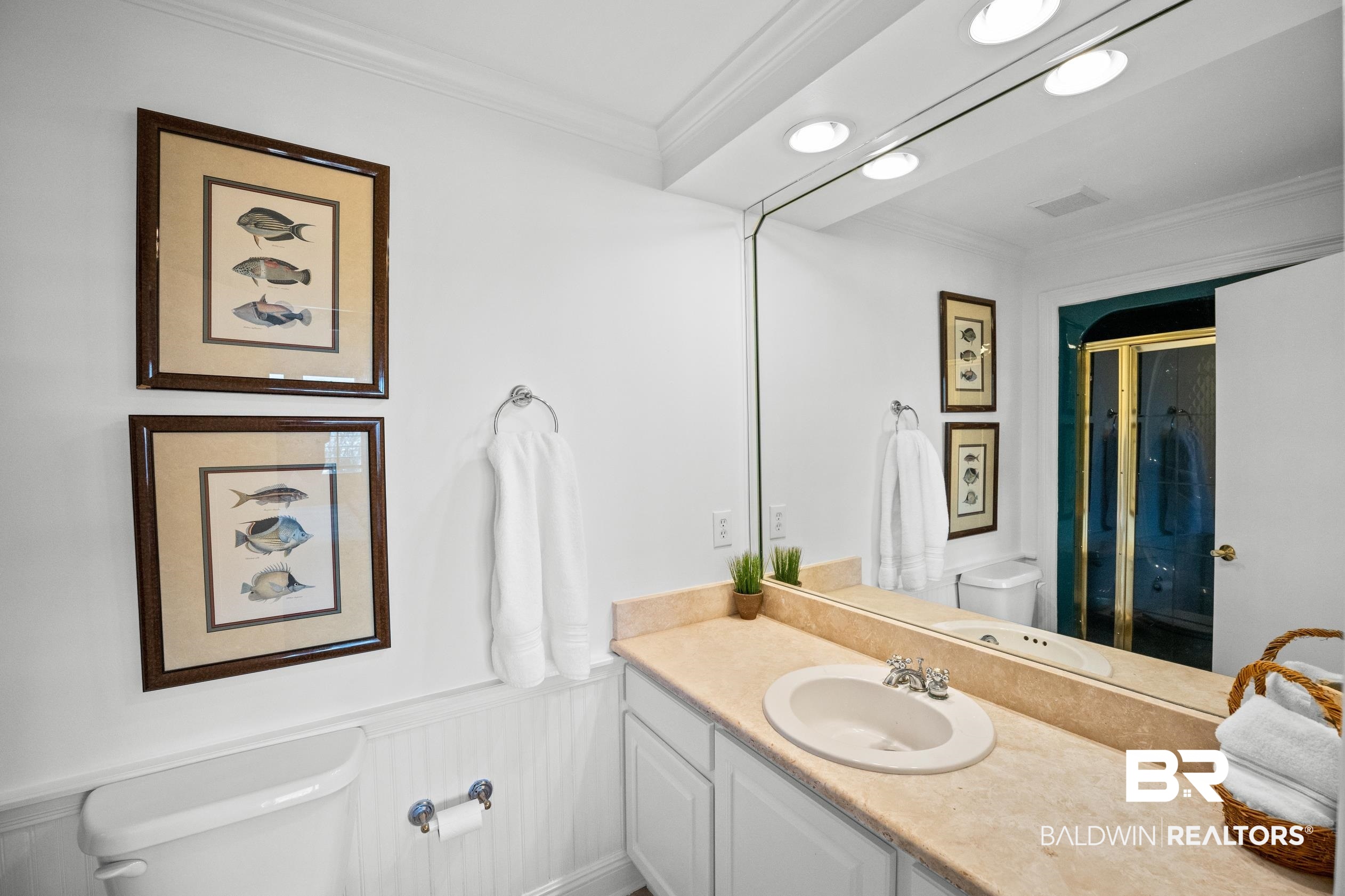 31304 River Road Orange Beach, AL 36561 - Photo 48 of 78 Bathroom with vanity, a stall shower, ornamental molding, and toilet
