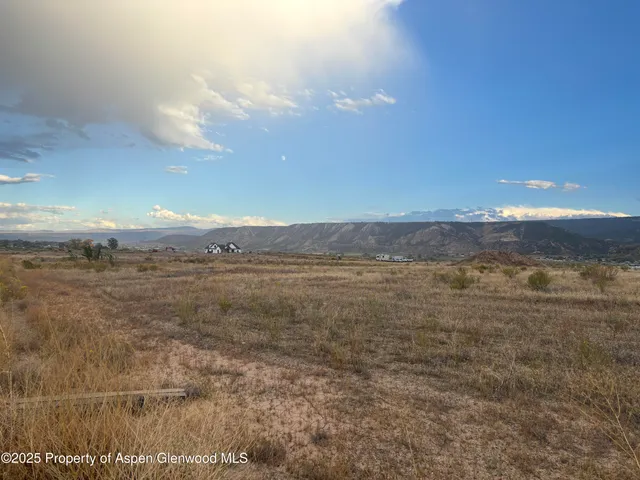 a view of an ocean and sunset