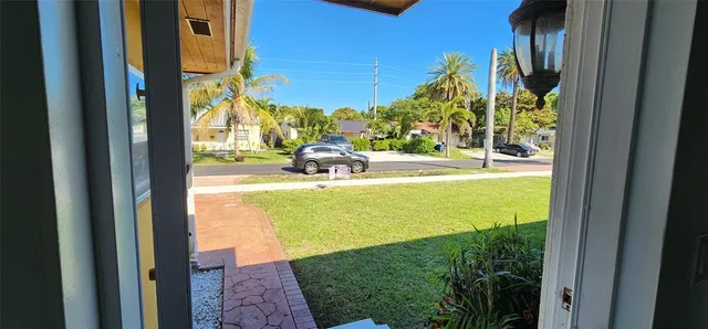 a kitchen with granite countertop wooden cabinets and stainless steel appliances