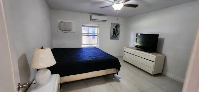 a white toilet sitting next to a shower curtain