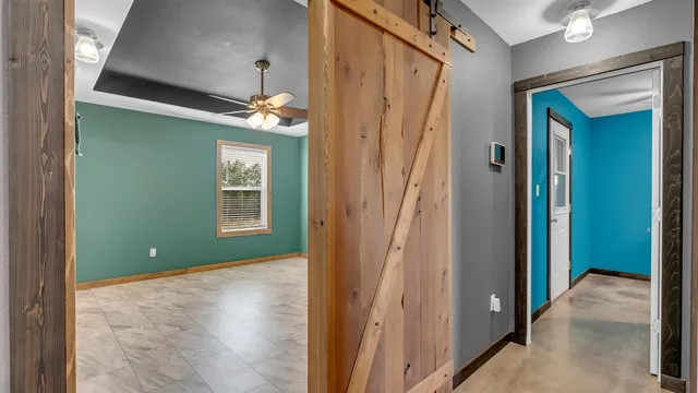 a view of a room with an empty room and window