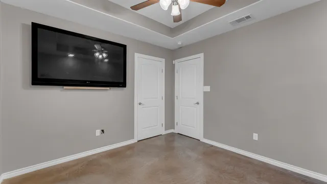a view of an empty room with a flat screen tv