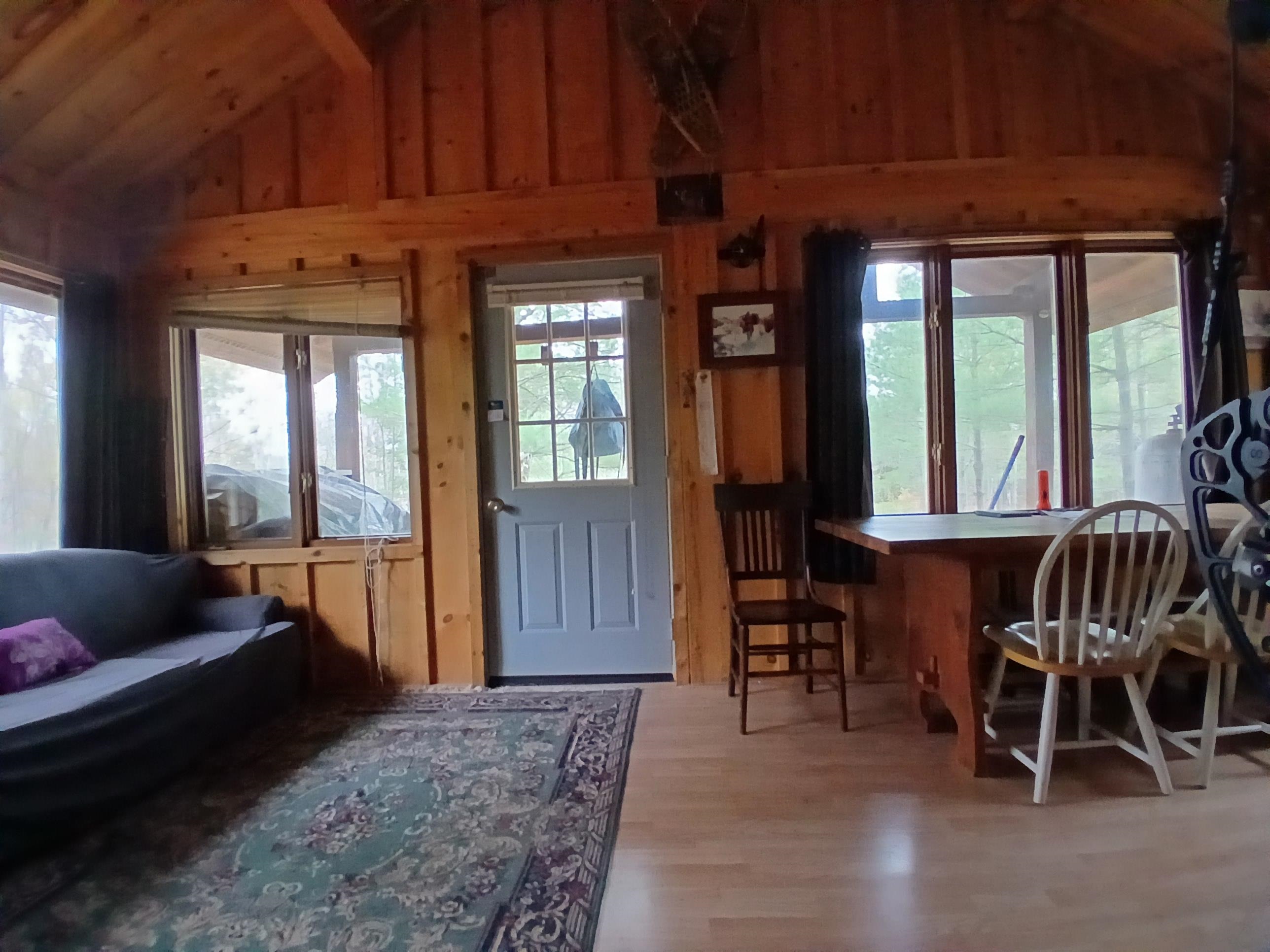 Tbd Echo Trail Tower, MN 55790 - Photo 2 of 35 Doorway to outside featuring wood finished floors and wood walls