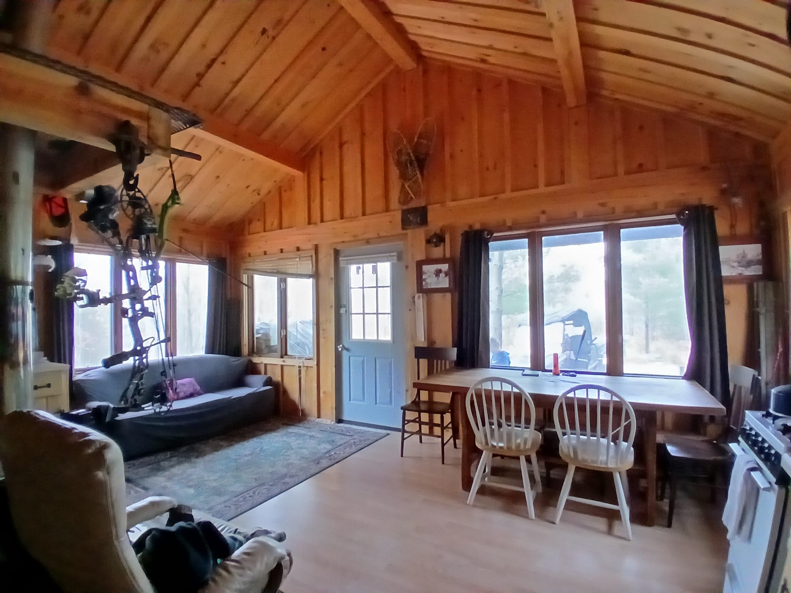 Tbd Echo Trail Tower, MN 55790 - Photo 4 of 35 Living room featuring a wood ceiling with exposed beams, wood finished floors, healthy amount of natural light, wooden walls, and high vaulted ceiling
