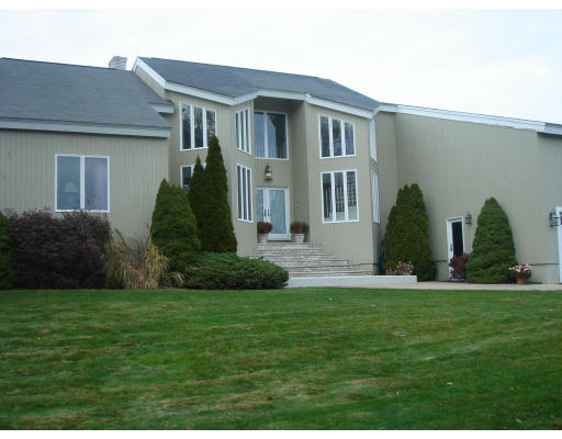 2 Links Road Gloucester, MA 01930 - Photo 1 of 7 a front view of a house with a garden