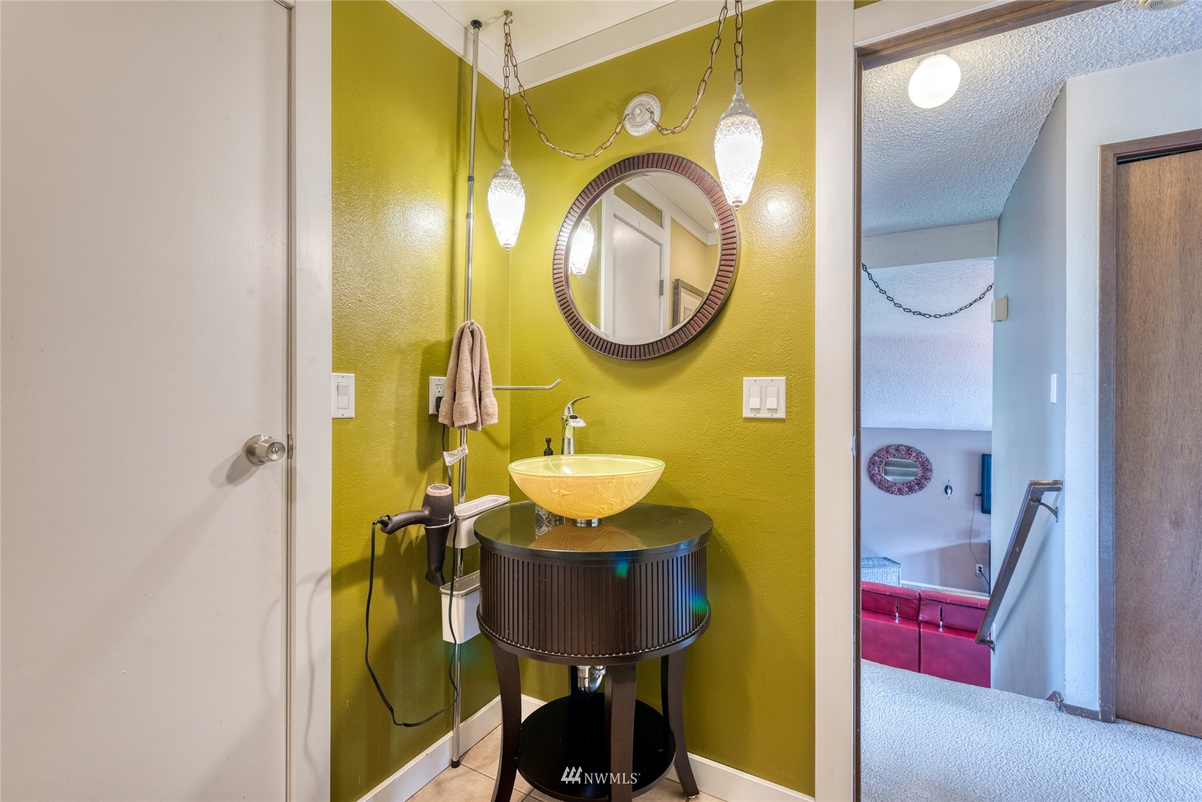 4406 Southeast 4th Place Renton, WA 98059 - Photo 26 of 35 a bathroom with a sink mirror vanity and toilet