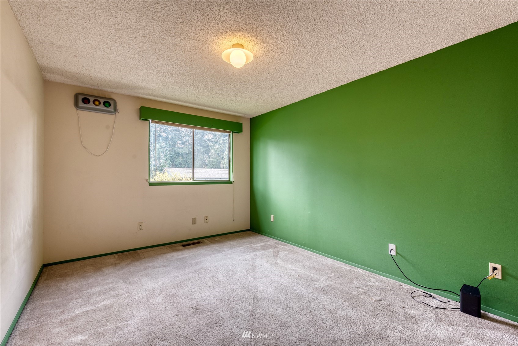 4406 Southeast 4th Place Renton, WA 98059 - Photo 27 of 35 a view of an empty room with a window and a ceiling fan