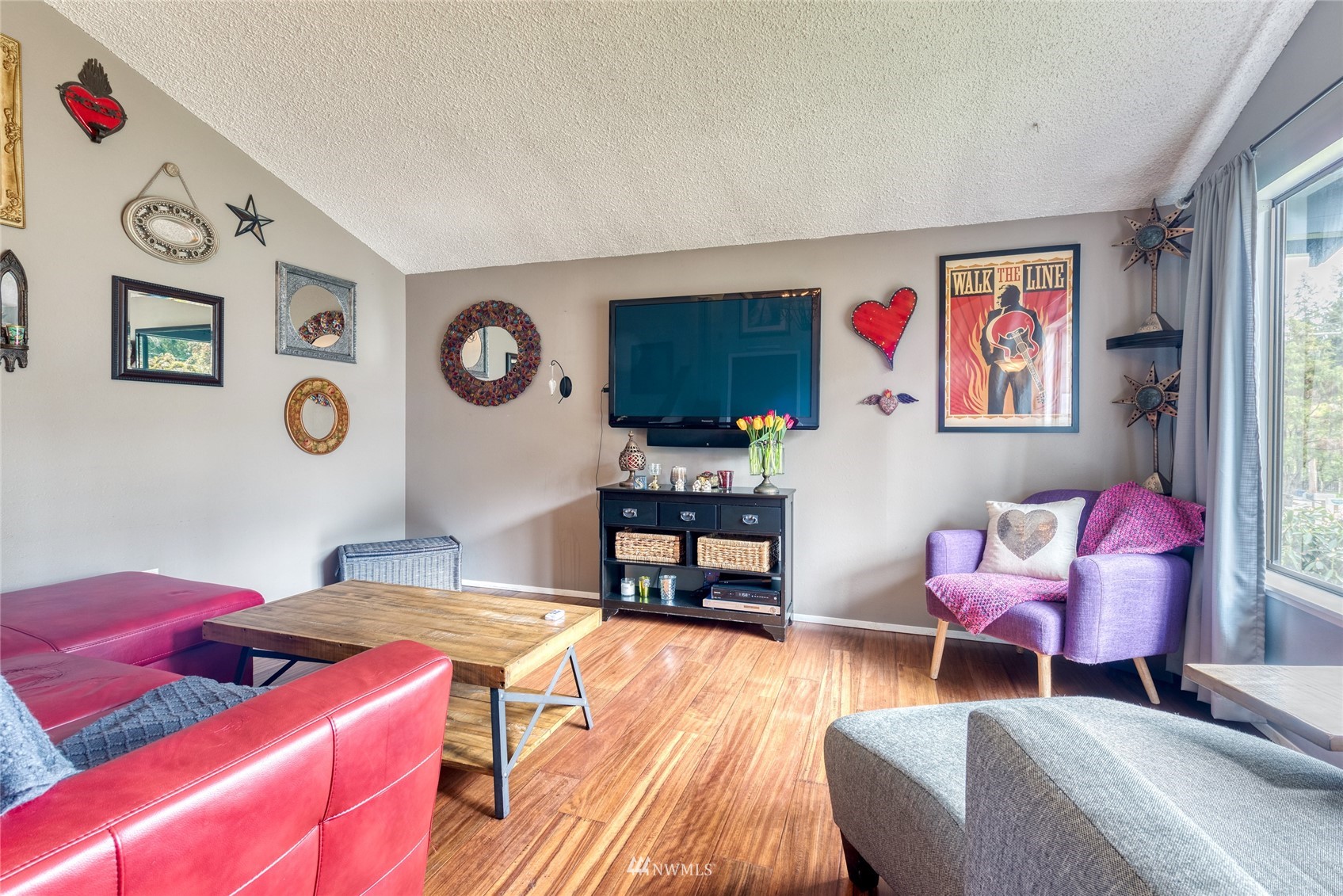4406 Southeast 4th Place Renton, WA 98059 - Photo 6 of 35 a living room with furniture a rug and a wooden floor