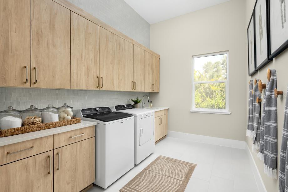 1821 Windermere Road Windermere, FL 34786 - Photo 13 of 19 a kitchen with stainless steel appliances granite countertop a stove a sink and a white cabinets