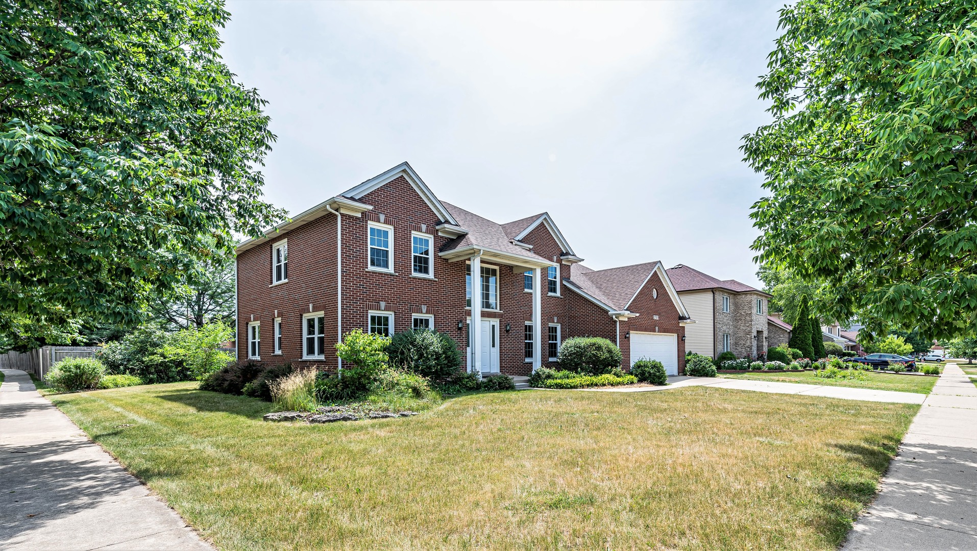 2740 Fairhauser Road Naperville, IL 60564 - Photo 1 of 2 a front view of a house with a yard and trees