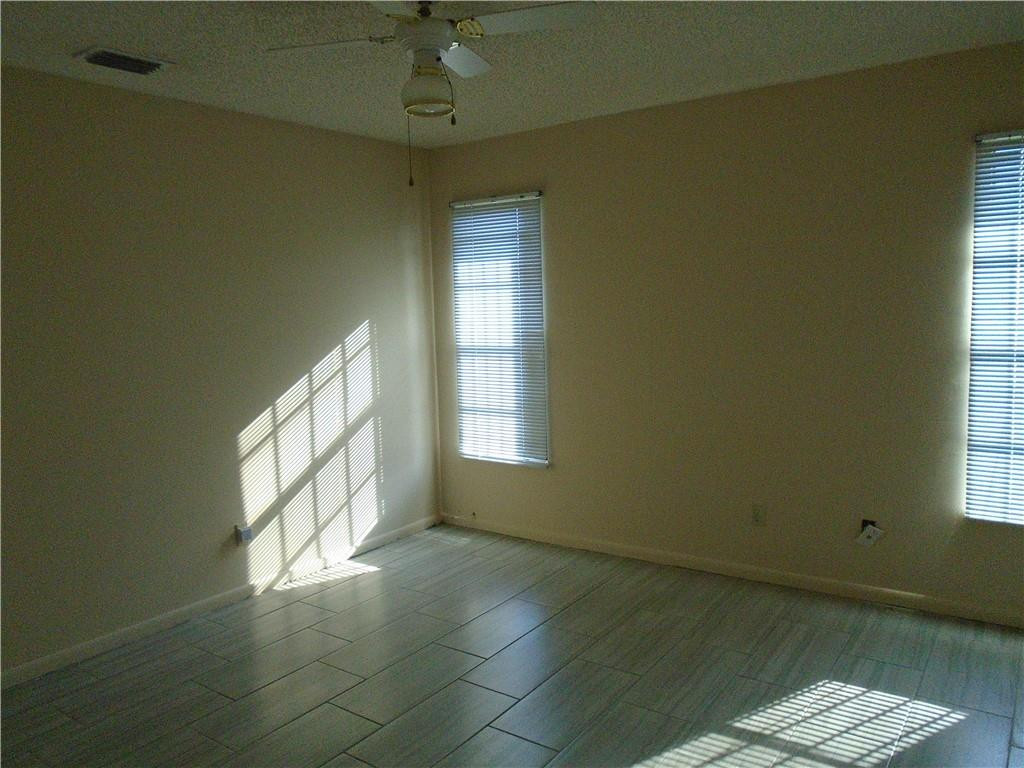 533 Banks Road Margate, FL 33063 - Photo 13 of 31 a view of an empty room with a window