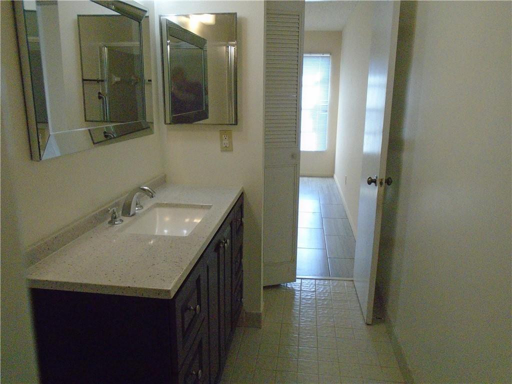 533 Banks Road Margate, FL 33063 - Photo 14 of 31 a bathroom with a sink and a mirror