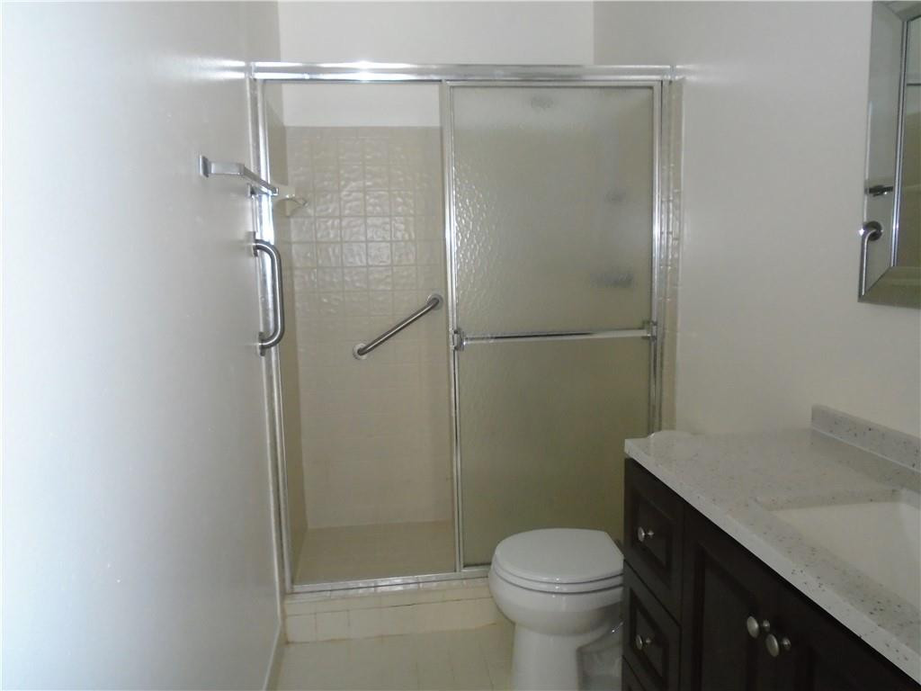 533 Banks Road Margate, FL 33063 - Photo 15 of 31 a bathroom with a shower toilet and sink