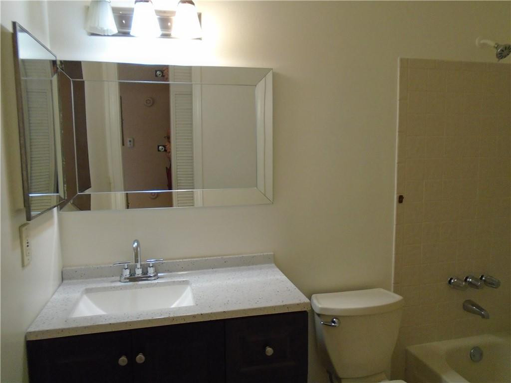 533 Banks Road Margate, FL 33063 - Photo 17 of 31 a bathroom with a sink toilet and shower