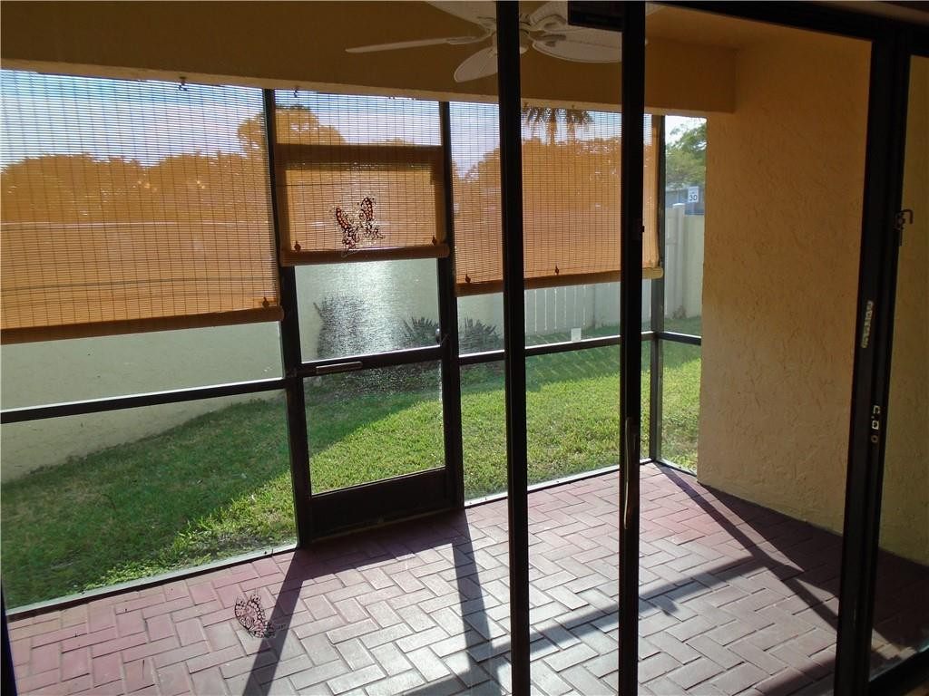 533 Banks Road Margate, FL 33063 - Photo 19 of 31 a view of a glass door with a balcony from a window