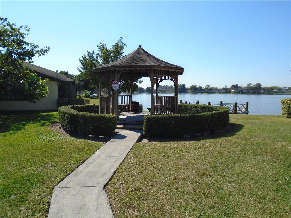 533 Banks Road Margate, FL 33063 - Photo 28 of 31 a view of a house with backyard sitting area and swimming pool