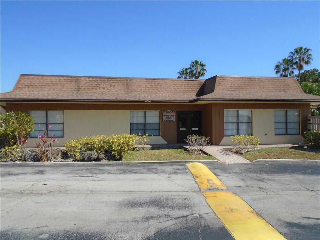 533 Banks Road Margate, FL 33063 - Photo 31 of 31 a front view of a house with a yard and potted plants