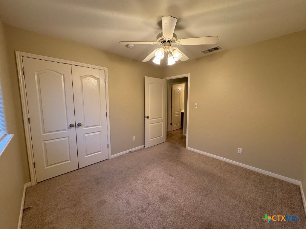 318 Silverado Trail Victoria, TX 77901 - Photo 12 of 14 a view of an empty room and chandelier fan