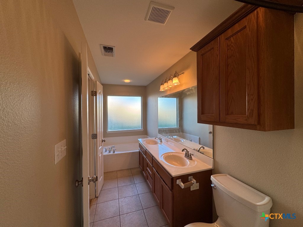 318 Silverado Trail Victoria, TX 77901 - Photo 8 of 14 a room with storage and utility