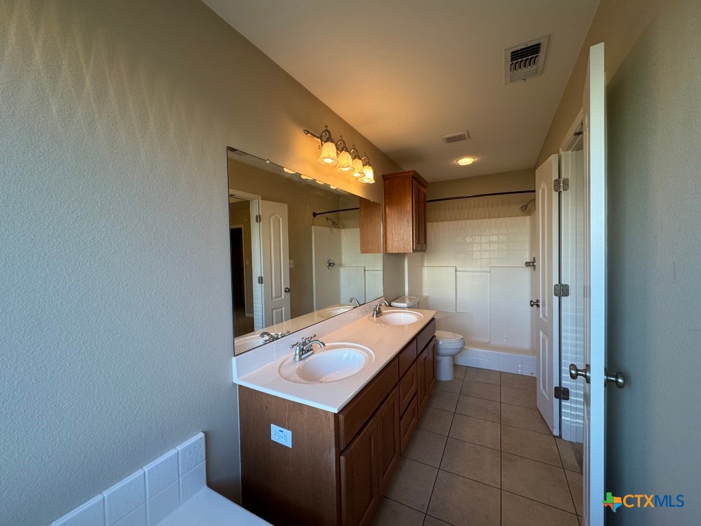 318 Silverado Trail Victoria, TX 77901 - Photo 9 of 14 a kitchen with a stove and a refrigerator