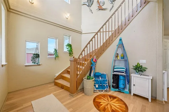 a view of a kitchen with wooden floor and furniture