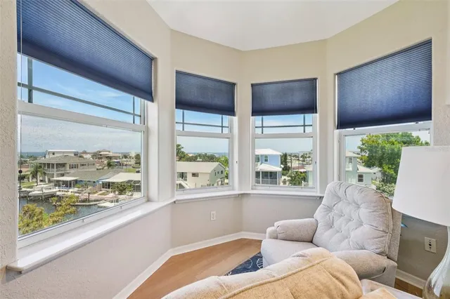 a view of a balcony with wooden floor