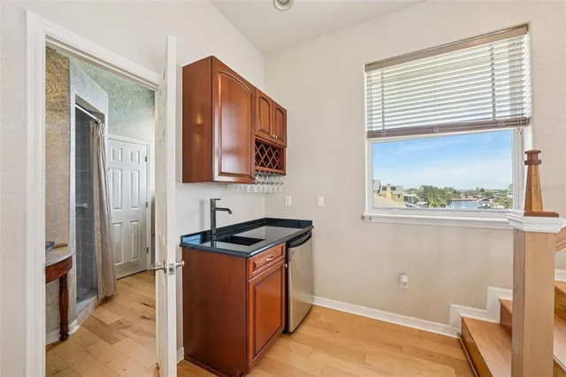 a front view of a house with a yard table and chairs