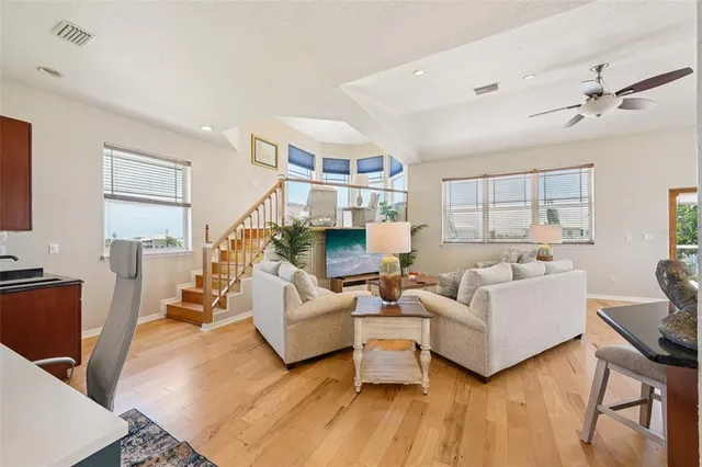 a living room with fireplace furniture and a flat screen tv