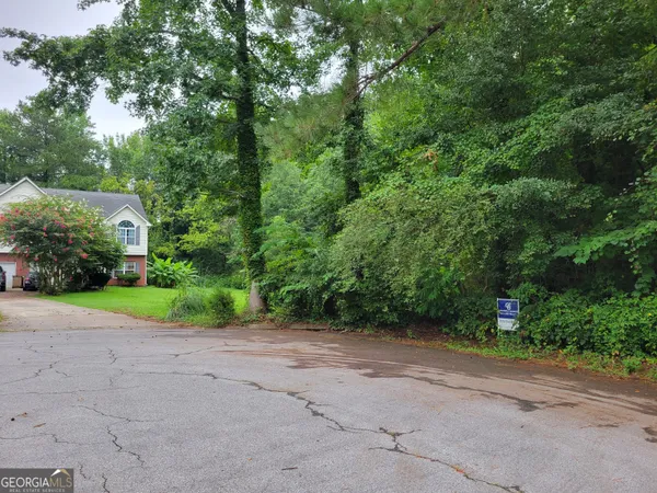 a view of a house with a street