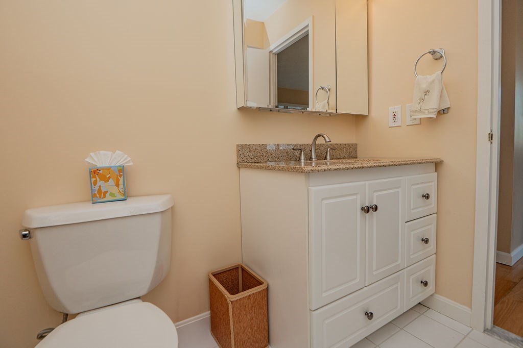 1006 Paradise Road, Unit PHO Swampscott, MA 01907 - Photo 12 of 27 a white toilet sitting next to a bathroom sink