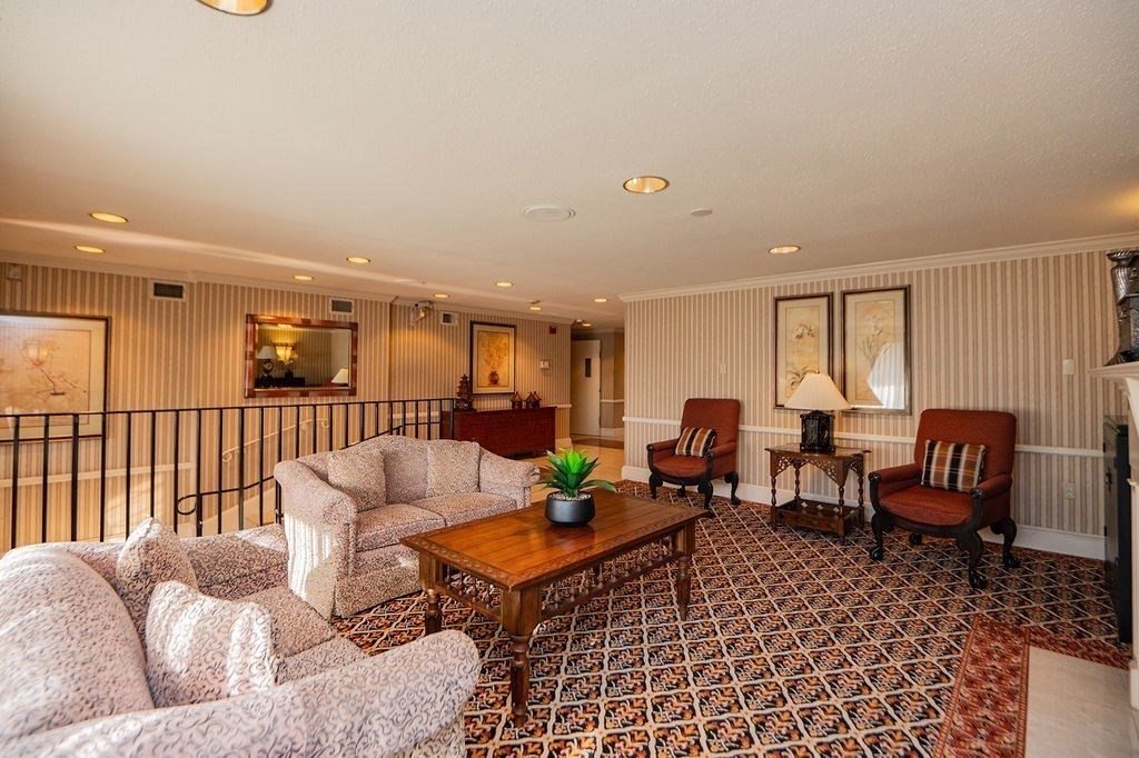 1006 Paradise Road, Unit PHO Swampscott, MA 01907 - Photo 24 of 27 a living room with furniture and a wooden floor