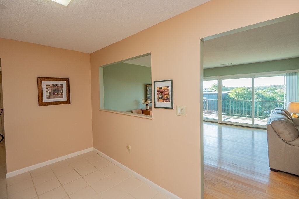 1006 Paradise Road, Unit PHO Swampscott, MA 01907 - Photo 7 of 27 a view of empty room with wooden floor and fan