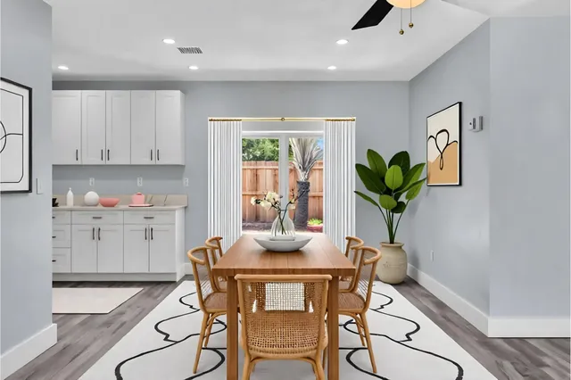 a kitchen with stainless steel appliances a refrigerator stove and sink