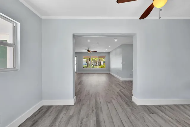 a view of a swimming pool with a patio and a yard