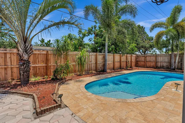 a view of a house with swimming pool