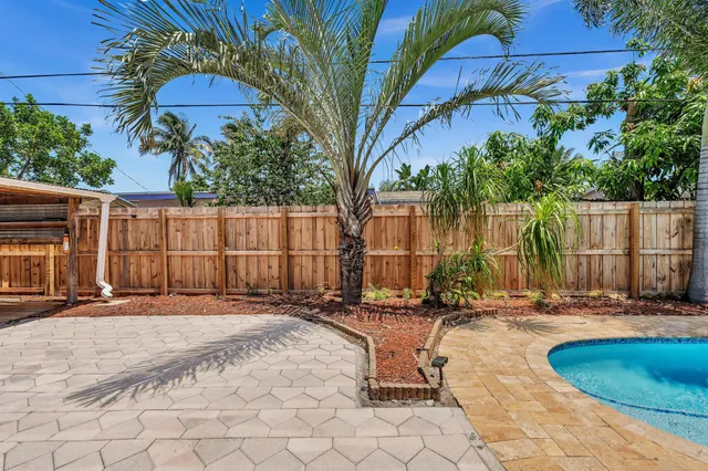 an aerial view of a house with a swimming pool